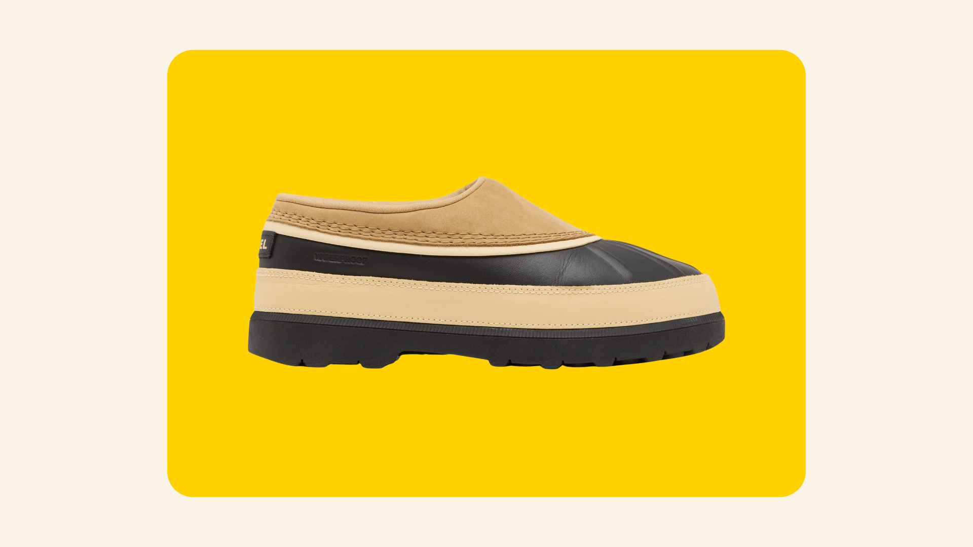Black and tan Sorel Ambler waterproof slip-on clog with a rubber duck-boot style sole