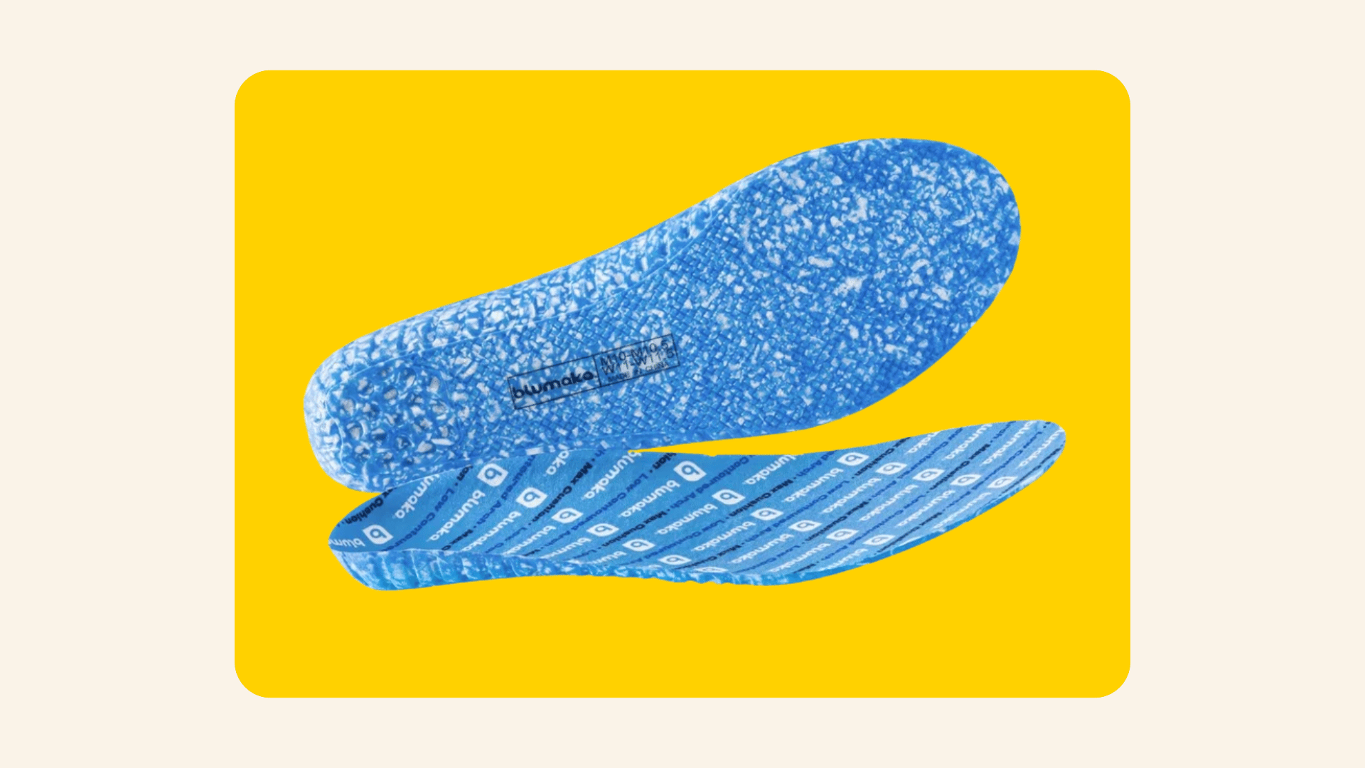Pair of blue speckled Blumaka performance insoles, one showing the patterned underside