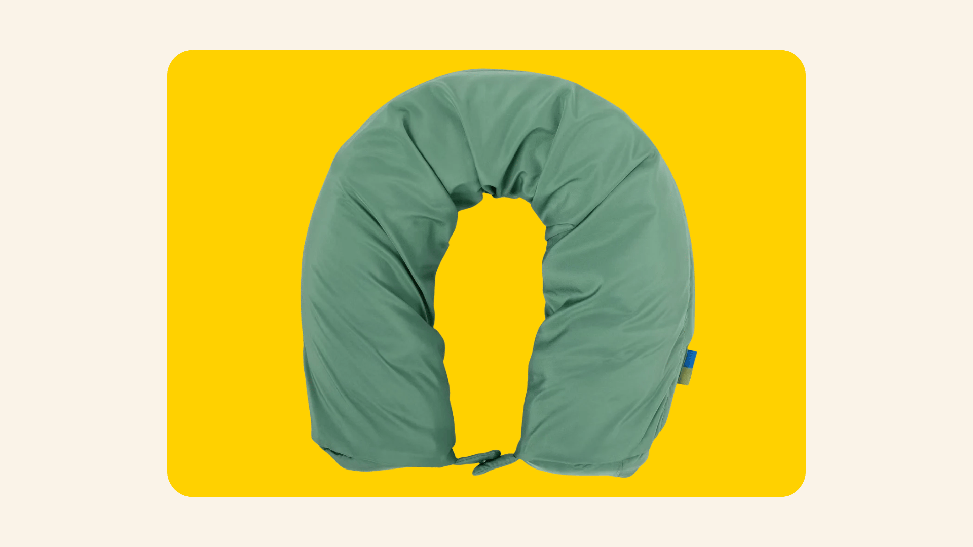 Green U-shaped packing cube that doubles as a travel neck pillow