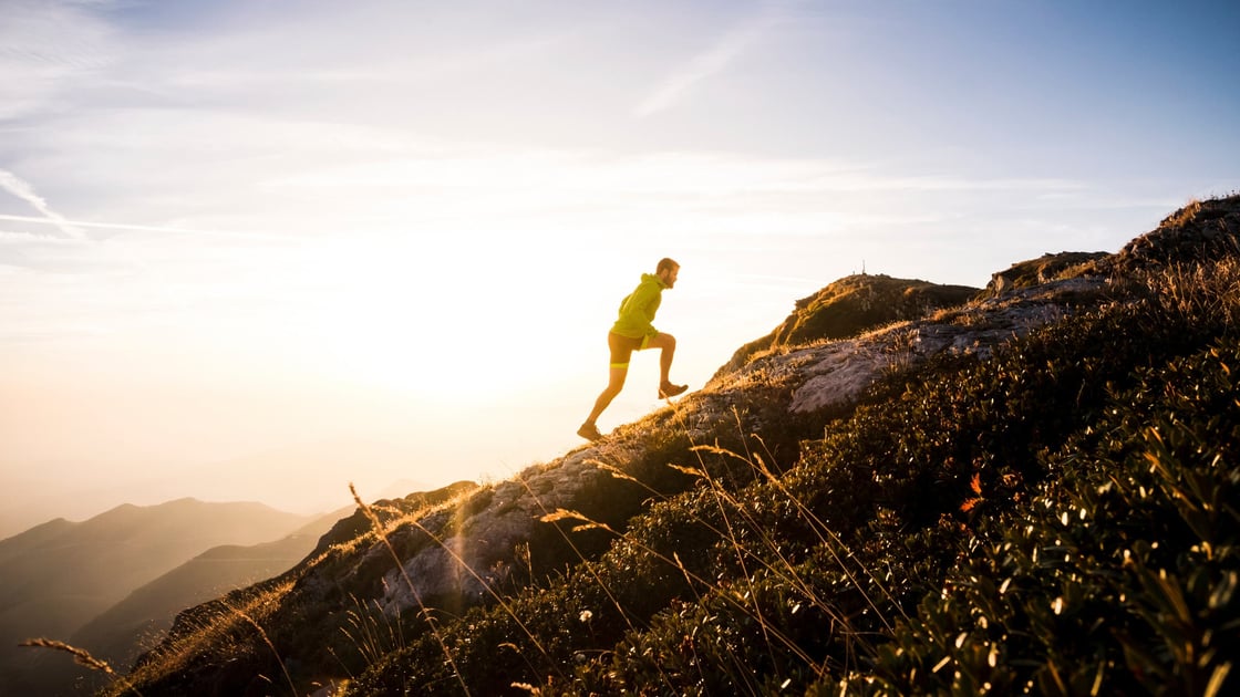 hiker-running-up-hill