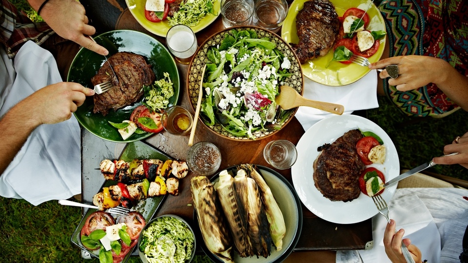 overhead-view-steaks-corn-outdoor-table_h-1