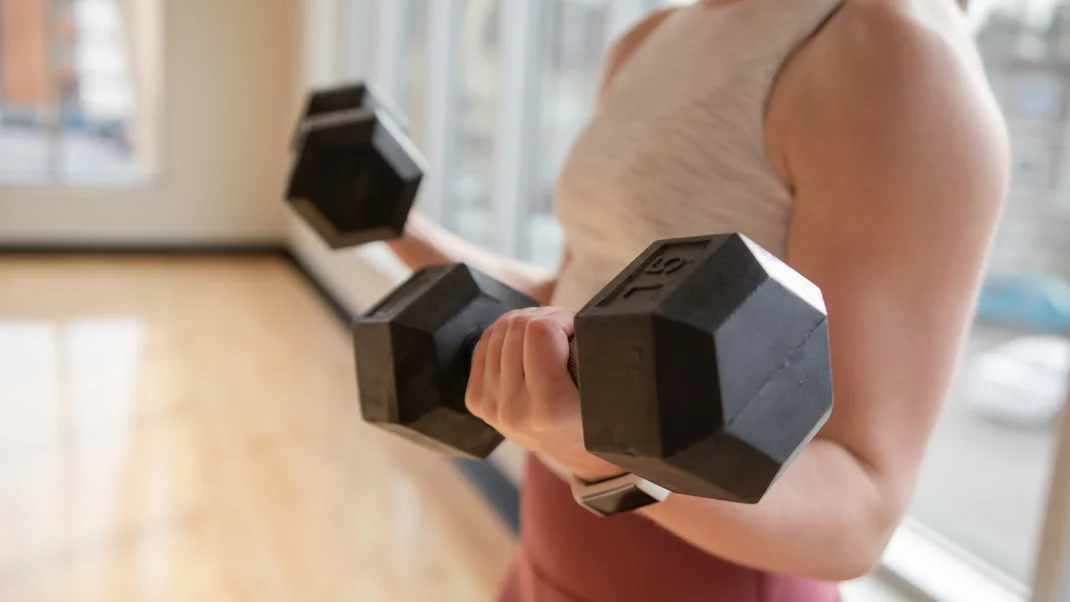 woman-training-dumbbells